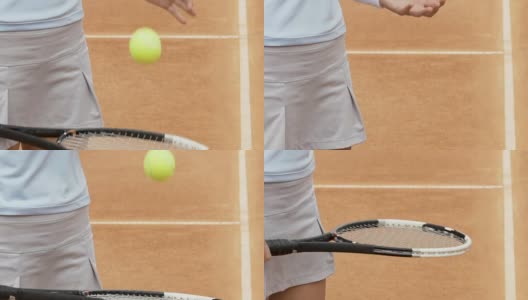 身材苗条的女孩正在用球拍打网球，在场上做赛前热身高清在线视频素材下载