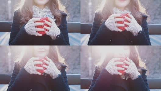 年轻女子喝着温热的茶，在大自然中高清在线视频素材下载