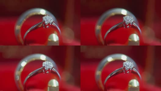红色背景上的结婚戒指。高清在线视频素材下载