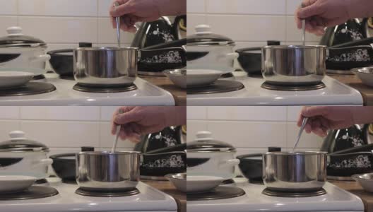 用勺子搅拌煮粥高清在线视频素材下载