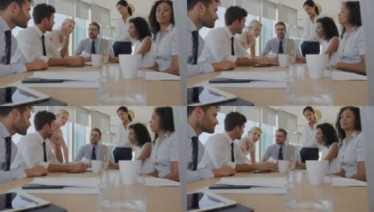 一群商务人士在办公室里围着桌子开会高清在线视频素材下载