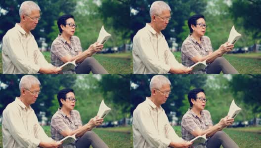 一对亚洲老夫妇在公园看书。花宝贵的时间，永远不要停止学习新东西高清在线视频素材下载
