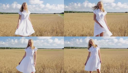 微笑的年轻女子在白色的裙子在谷物地里高清在线视频素材下载