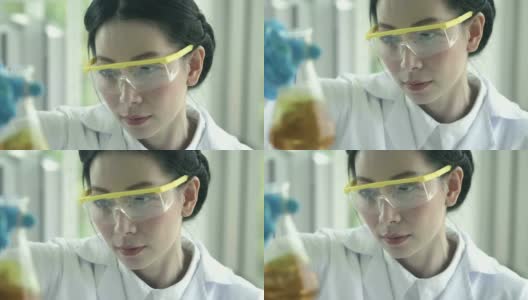 亚洲女化学家将黄色物质倒入试管中高清在线视频素材下载