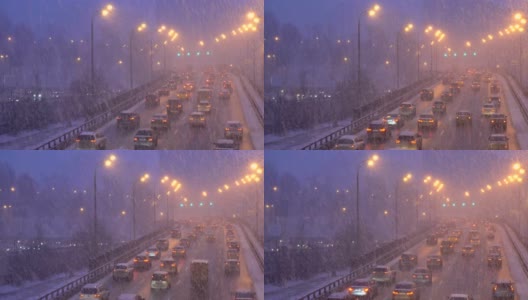 城市道路上的汽车在大雪中移动高清在线视频素材下载