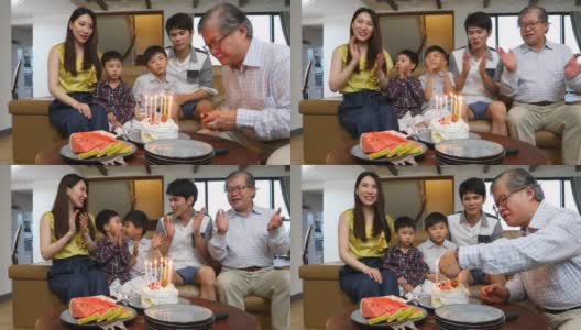 亚洲家庭用蛋糕唱生日快乐歌高清在线视频素材下载