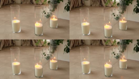 婚礼装饰，蜡烛放在地板上的玻璃瓶里。高清在线视频素材下载