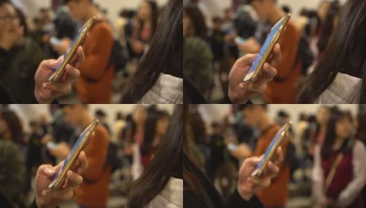 4K亚洲女人与人群，检查智能手机做快速短信高清在线视频素材下载