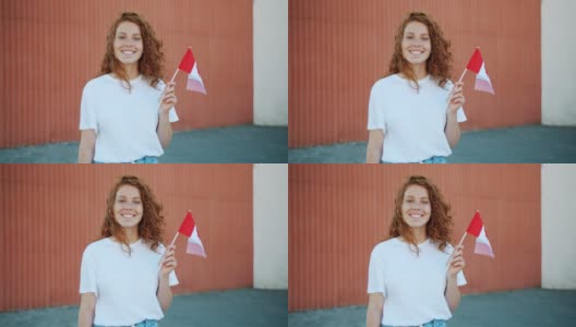 快乐的女学生在户外举着加拿大国旗微笑的慢镜头高清在线视频素材下载