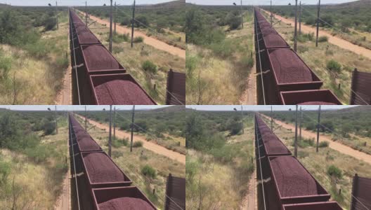 铁矿石由南非一列非常长的货运火车用铁路卡车运输高清在线视频素材下载