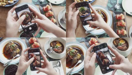 近距离的女人用智能手机拍照的食物高清在线视频素材下载