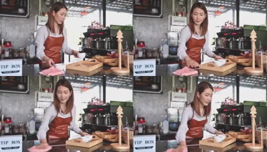 亚洲咖啡师在她的小咖啡店工作的肖像。新常态的创业小型企业高清在线视频素材下载