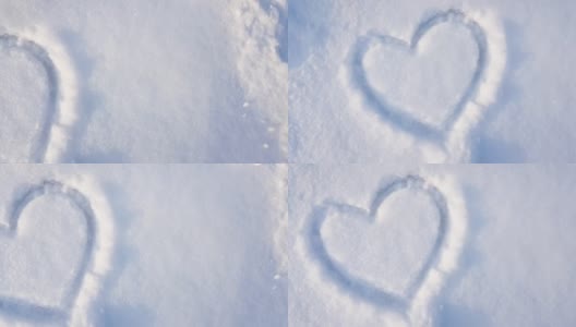 4K视频，在公园的雪地上画一颗心。情人节，城里的寒假，慢镜头高清在线视频素材下载