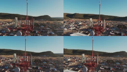 一个通信基站塔在圣胡安尼托，奇瓦瓦，墨西哥，在Sierra Madres，山城，镇下面，无人机视频剪辑高清在线视频素材下载