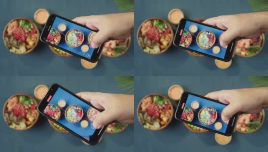用智能手机俯视图录制夏威夷戳碗的视频。由切成片的蔬菜、海鲜和绿叶植物制成的熟戳。健康的素食。亚洲素食生食，筷子高清在线视频素材下载