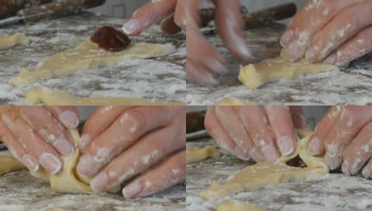 把面团揉成牛角面包的形状。自制的甜糕点。果酱，女人亲手做的面团。在家里的厨房里用手做果酱饼干高清在线视频素材下载