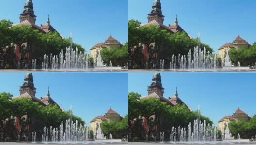 2021年9月12日，塞尔维亚，苏博提卡。Subotica广场上的喷泉位于市政厅、国家剧院大楼和城市图书馆之间。清澈的水柱、水花和水滴高清在线视频素材下载