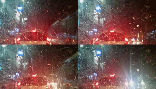 车外下雨，雨水滴落在车前与交通堵塞高清在线视频素材下载