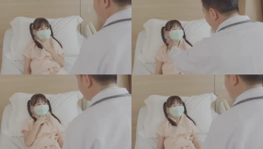 医生在病房探望一个小女孩的康复病人。高清在线视频素材下载