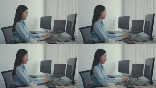 亚洲妇女工作代码程序开发人员电脑网页开发工作设计软件在办公桌上的办公室。高清在线视频素材下载