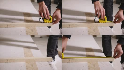 卷尺测量小木板高清在线视频素材下载