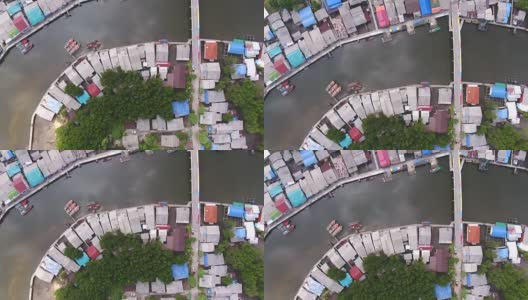 鸟瞰宁静的海岸村庄与弯曲的河流和海洋背景，航拍视频高清在线视频素材下载