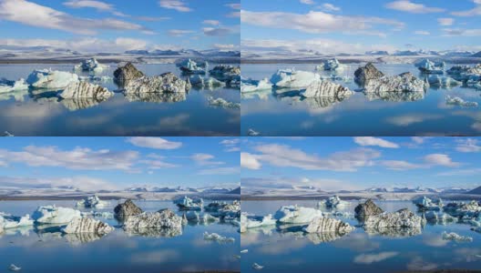 4k时间移动的云与蓝色冰山漂浮在Jokulsarlon冰湖，冰岛高清在线视频素材下载