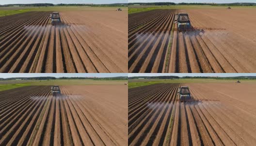 农民在拖拉机上向犁过的田地喷洒化肥和化学药品高清在线视频素材下载