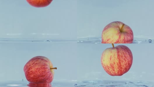 一个苹果掉进水里的慢镜头。高清在线视频素材下载