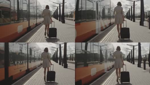 带着行李在火车站行走的自信女人高清在线视频素材下载