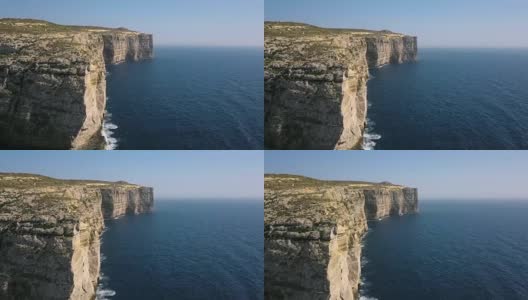 风景鸟瞰图戏剧性的高悬崖与美丽的海景。无人机俯视图拍摄的危险石崖附近的大海。马耳他、Gozo高清在线视频素材下载