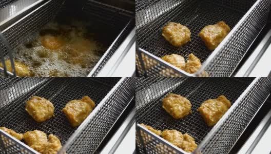 烹饪油炸面包屑鸡。在热油炸锅里炸鸡块的特写高清在线视频素材下载