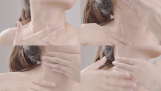 在脖子上涂保湿霜的女人。医疗保健的概念高清在线视频素材下载