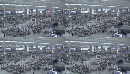头顶广角拍摄许多人在上海虹桥火车站的大出发大厅高清在线视频素材下载