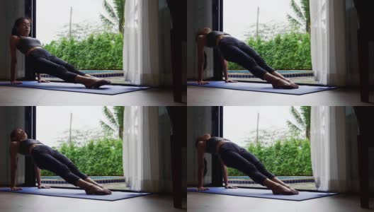 亚洲女性以苗条的身材在家练习瑜伽，积极健康的生活方式理念高清在线视频素材下载