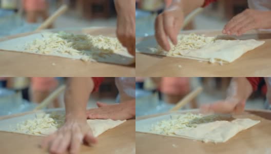 用奶酪做皮塔饼。在餐厅准备面饼卷高清在线视频素材下载