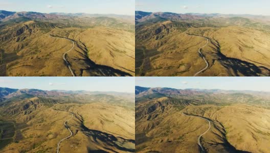 天线:高速公路穿过丘陵地带和遥远的山脉高清在线视频素材下载