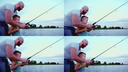 一个男人带着一个孩子去钓鱼，父子俩用旋转杆钓了一条鱼，在湖上进行户外娱乐，渔夫坐在船上，扔钓竿和鱼饵高清在线视频素材下载