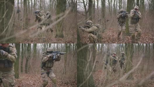 一群年轻的武装士兵在一个地区的武装冲突中穿着制服以突击步枪瞄准森林，慢镜头，软式高清在线视频素材下载