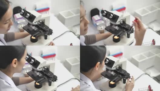 在实验室里用显微镜和药片工作的科学家高清在线视频素材下载
