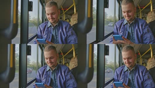一个年轻人在公交车上用智能手机高清在线视频素材下载