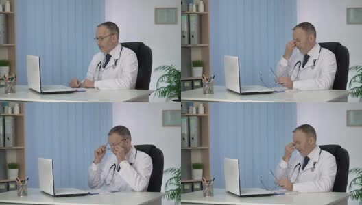 男医生看病人的病历，辛苦工作一天后疲惫不堪高清在线视频素材下载