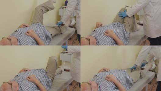 男神经科医生检查一位老年病人高清在线视频素材下载