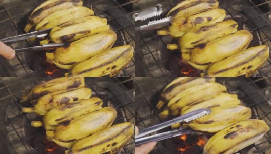 有人在传统的炭炉上烤香蕉皮。烧烤食物。泰国菜。热带地区的甜水果甜点。高清在线视频素材下载