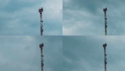 手机信号塔和雨后天空灰蒙蒙的云朵，时光流逝。高清在线视频素材下载