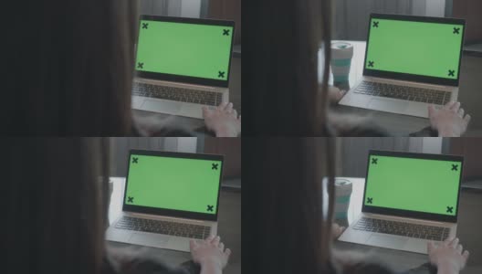 特写女人使用Chroma键屏幕笔记本电脑在家里的桌子上高清在线视频素材下载