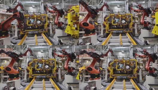 机器人在现代化的工厂里焊接新汽车的零件高清在线视频素材下载