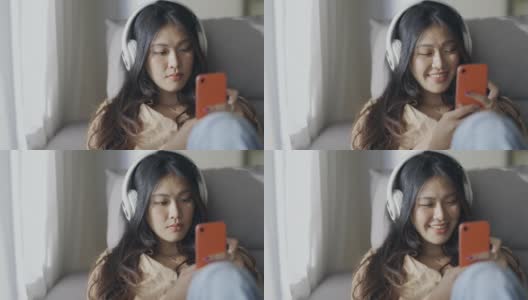 亚洲女性在家里使用智能手机高清在线视频素材下载