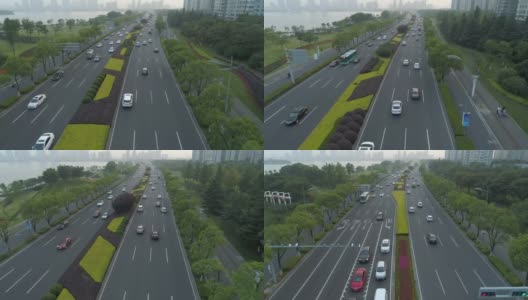 鸟瞰图的汽车运行在城市道路上的日落，中国。高清在线视频素材下载