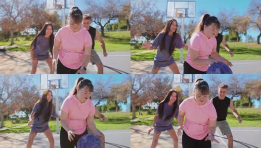 患有唐氏综合症的女孩和家人一起打篮球高清在线视频素材下载